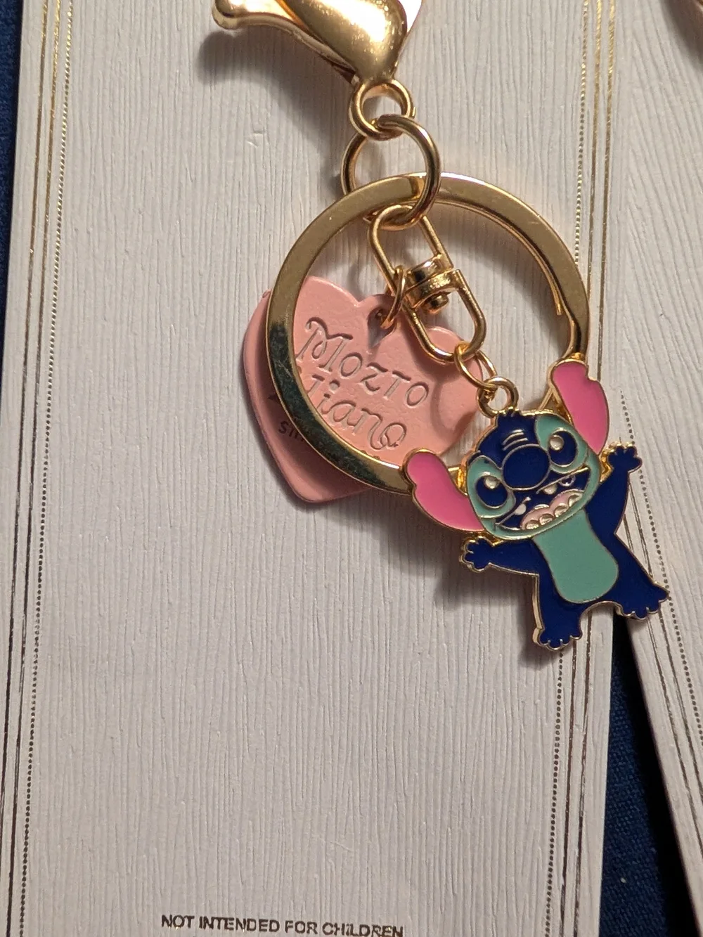 4 New Gold Keychain with Blue and Pink Stitch Character
